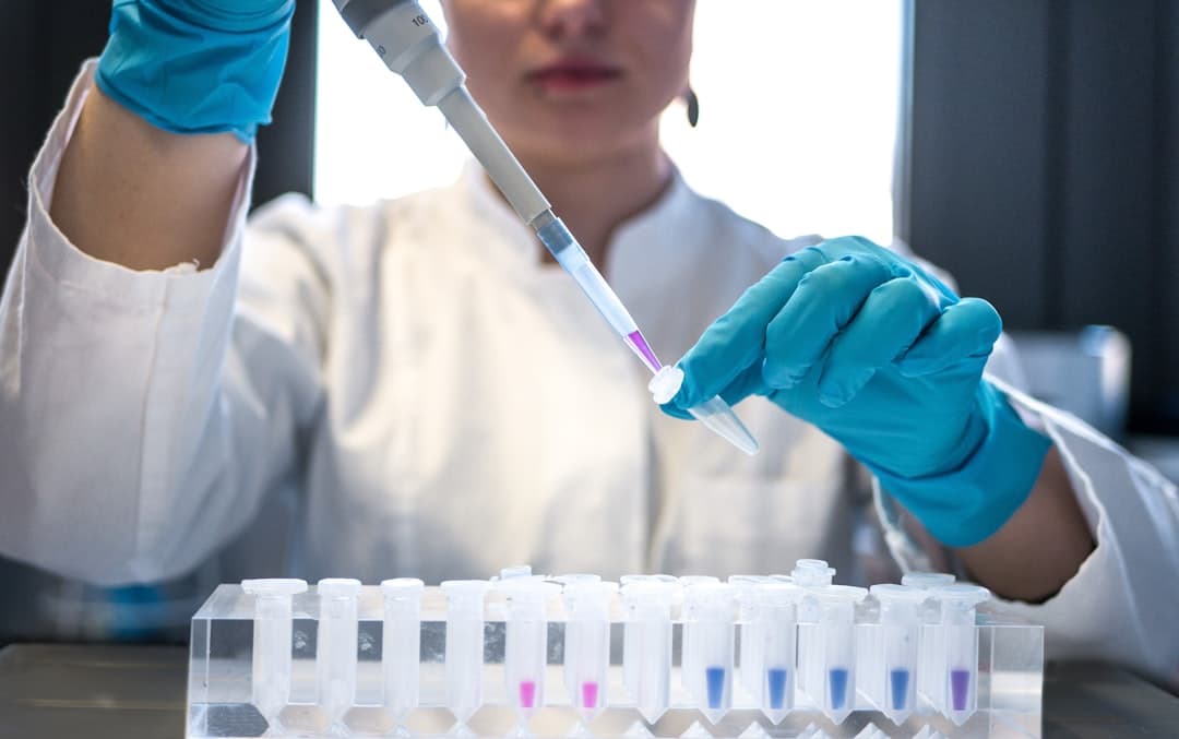 Scientist preparing samples at the Air Allergen lab