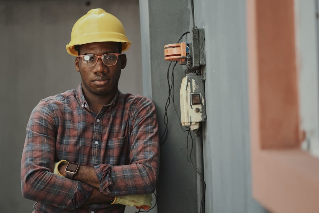 Inspector in protective gear examining a building interior