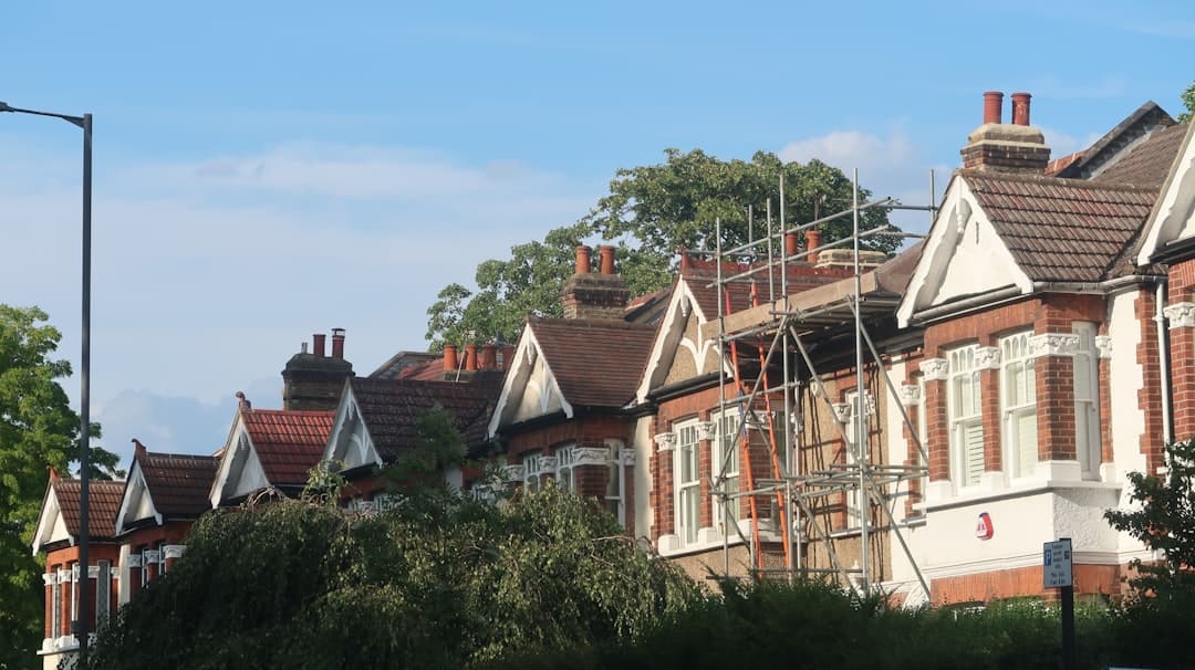 Certified asbestos inspector surveying a residential property