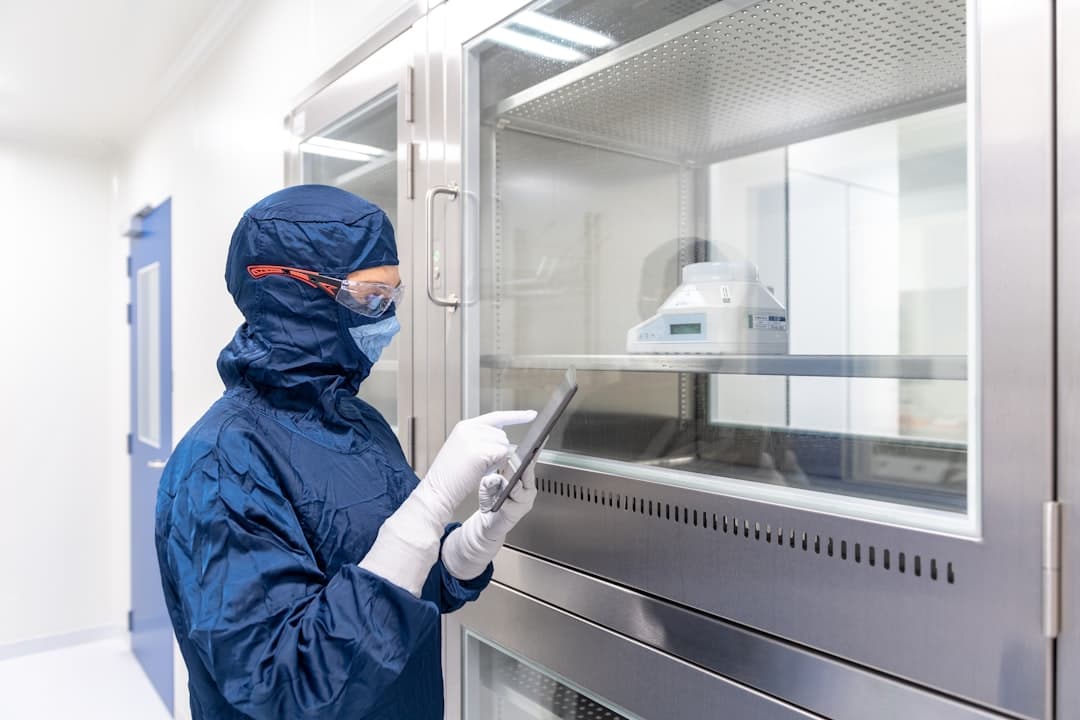 Scientist working in a pharmaceutical clean room
