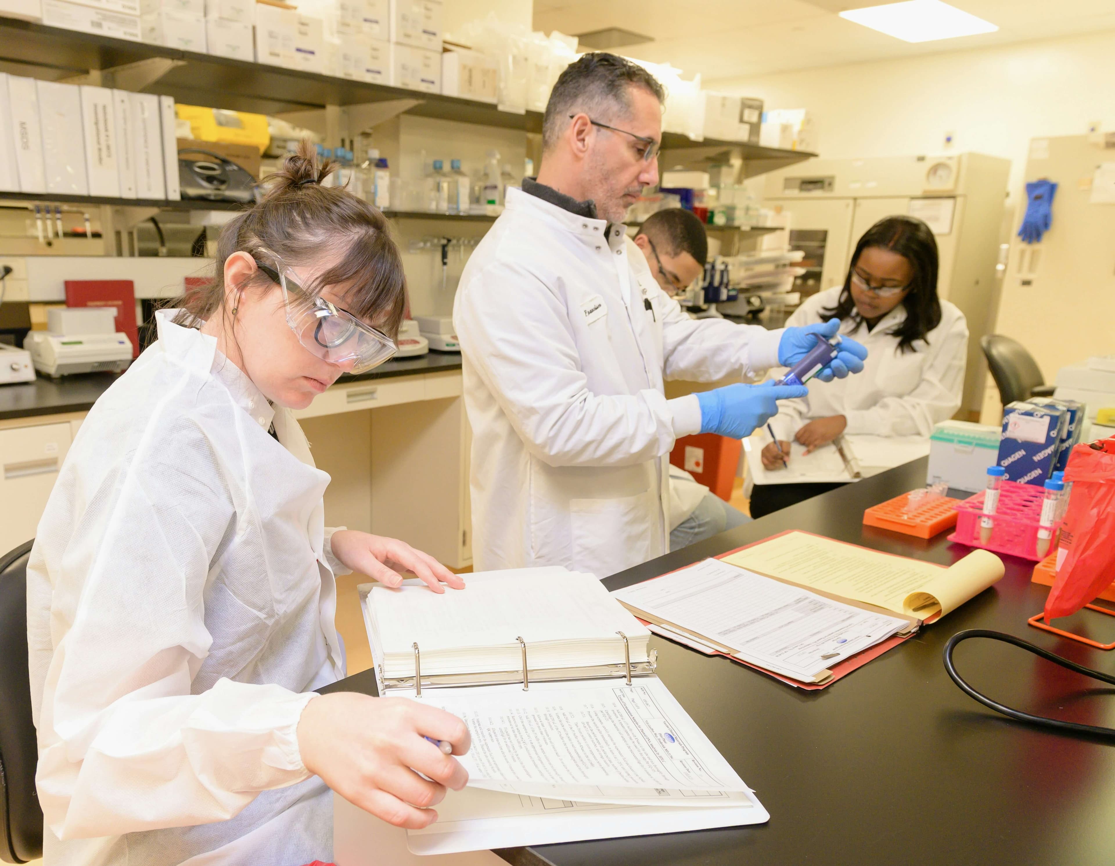 Lab analyst processing MIC 5 kit culture vials