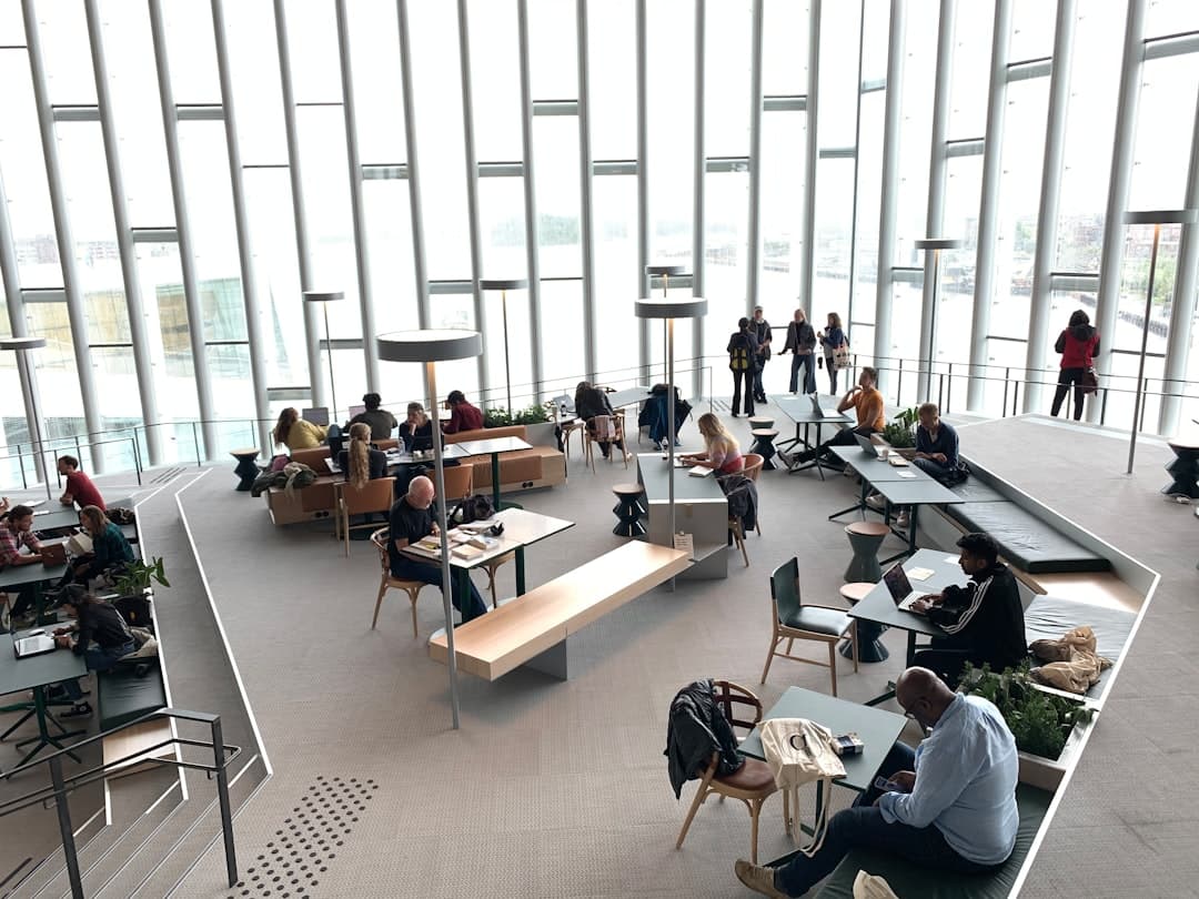Office workers in a bright open-plan facility