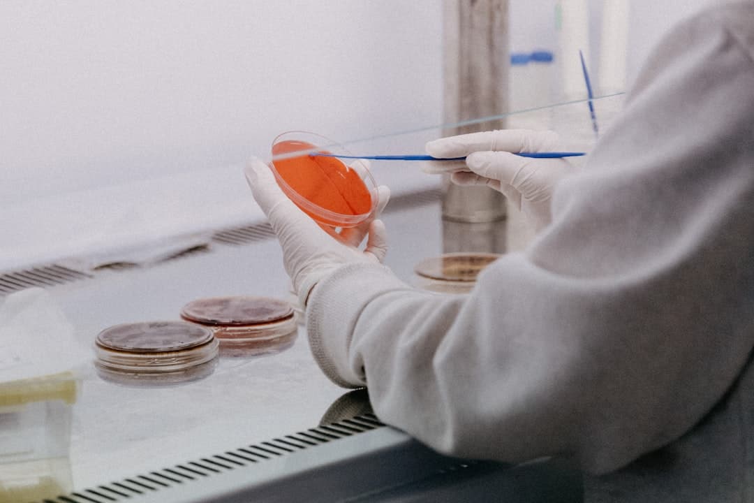 Lab worker handling a sample dish