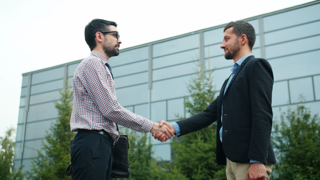 Two professionals discussing a partnership