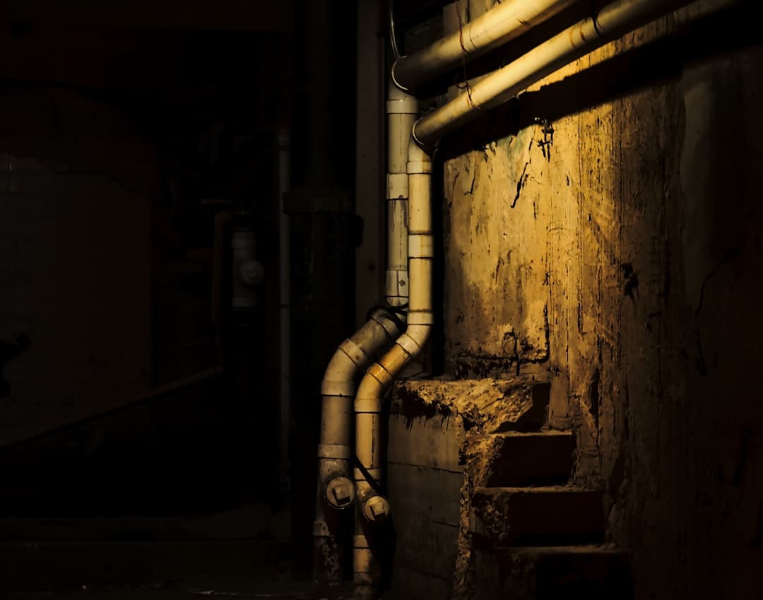 Hot water plumbing pipes in a building utility space